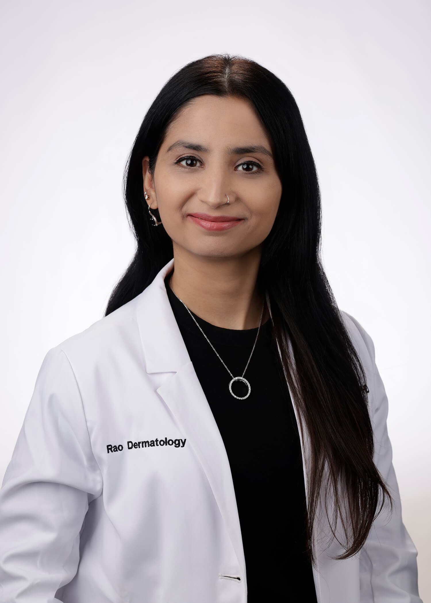 Headshot of Attiya Haroon, MD, PhD, FAAD